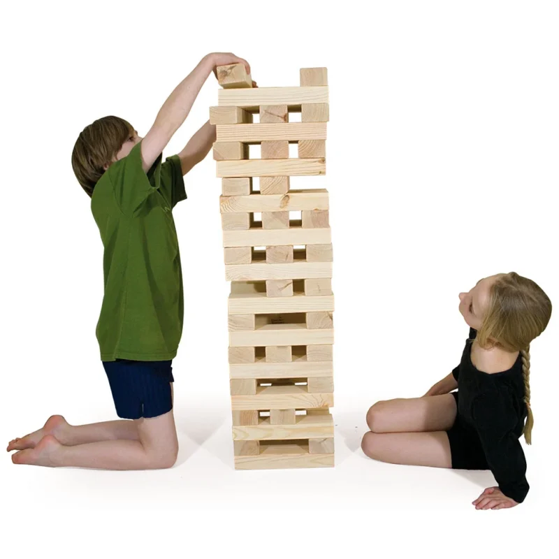 children-playing-with-giant-wooden-tower-block